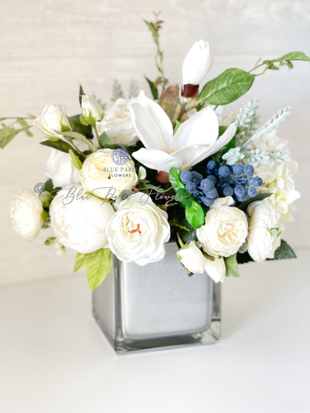 winter white artificial flowers arrangement in glass vase. Faux hydrangeas,  white peony and skimmia — Victoria James Floral Designs